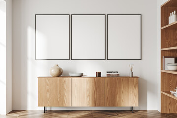 Light living room interior dresser and shelf with art decoration, mockup frames
