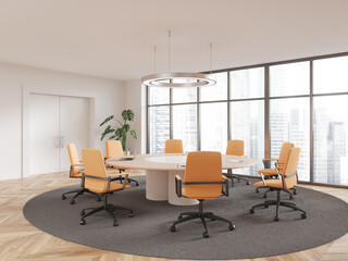 White meeting room interior with round table and door