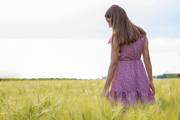 A young girl in a wheat field