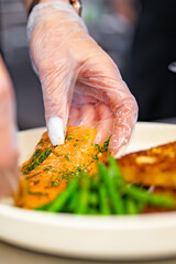 woman chef hand cooking food on kitchen