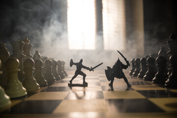 Medieval battle scene with cavalry and infantry on chessboard. Chess board game concept of business ideas and competition and strategy ideas Chess figures on a dark background with smoke and fog. - obrazy, fototapety, plakaty