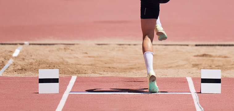 Long jump men athlete jump in athletics competition, sportsman landing his leg on board before taking off in long jump or triple jump