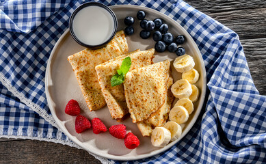 Home-made Polish pancakes filled with sweet cottage cheese