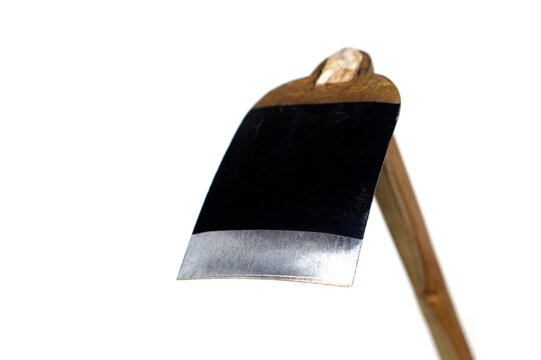 Metal hoe isolated on white background. Concept, gardening tool. Thai farmers use hoe to dig soil for agriculture, get rid of weeds or grass, dig holes for construction.                    