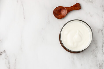 Obraz na płótnie Canvas yogurt on a light background, Probiotic cold fermented dairy drink. place for text