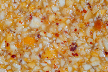 Honey granola hazelnuts bar - Gozinaki: caramelized nuts fried in honey - close up. Traditional...