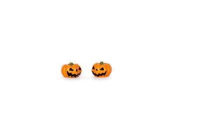 Two small scary fake carved pumpkins isolated on a white background
