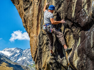 Climber on a mountain of the Italian Alps