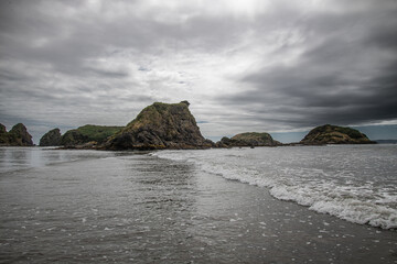 penguin islets and punihuil beach chiloe chile under a stormy sky