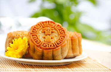 Mooncake, Chinese mid-autumn festival food for the Dessert Concept. It involves the appreciation of the full moon and various cultural activities significantly. The Celebration of Chinese Heritage.