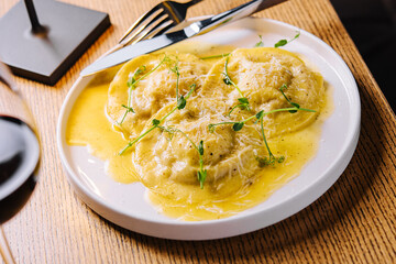 Italian ravioli with glass of wine