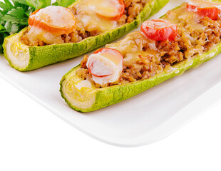 Zucchini stuffed with meat, vegetables and cheese