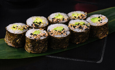 Sushi Maki With Avocado on black plate