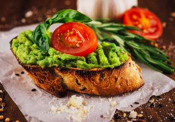 Homemade bruschetta with pesto sauce on rustic background