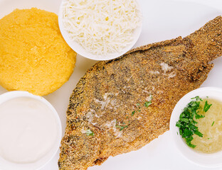 Traditional Moldavian porridge made from hominy and fish with goat cheese