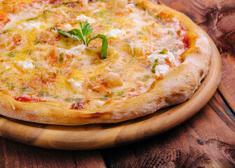 Shrimp pizza with different types of cheese