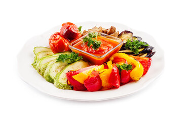 Grilled colorful vegetables on white plate