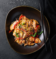 Asian udon noodles with chicken vegetables and teriyaki sauce