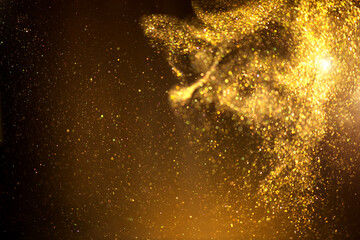 Golden sparks, Christmas and New Year glittering stars swirl on black bokeh background, backdrop with sparkling gold, holiday garland, magic glowing dust, lights. Gold Abstract Glitter Blinking sparks
