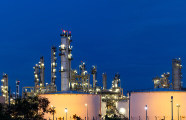 Oil and gas refinery plant firm industry zone at night.Oil and gas Industrial petrochemical fuel power and energy.Chemical Industry.Gas storage tanks and oil storage tank in refinery industrial plant.