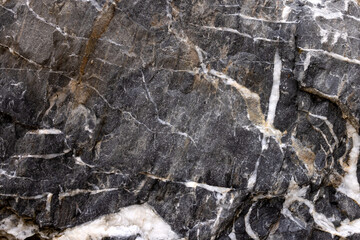 Background from a photo of a chipped dark marble with white veins and cracks