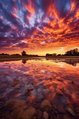 Obraz premium colorful sunset sky with contrasting cloud formations, created with generative ai
