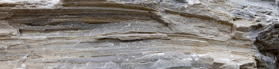 Obraz na płótnie Canvas Layered natural stone in Alps with deep cracks. 4x1 Banner to websites, social network or printing