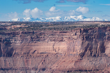 Snowy mountains and canyon walls from the West Rim Trail, Dead Horse Point State Park, Utah