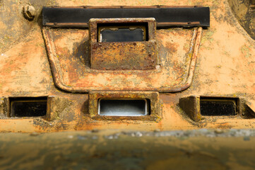 Peephole of decomissioned rusty old soviet era armoured vehicle