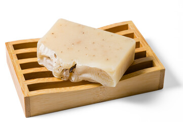 Bars of handmade organic soap on bamboo soap tray isolated on white background