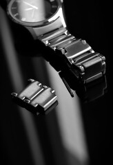 Watch with links and pin for metallic strap black and white image