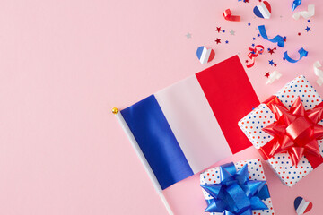 Patriotic gifts on Bastille Day idea. Top view composition of gift boxes with bows, french flag,...