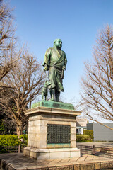 Fototapeta na wymiar Tokyo Japan Mar 11th 2023: the statue of Saigo Takamori in Ueno park. One of Japan's most iconic historical figures and his loyal dog. A man often dubbed as the ‘last true samurai'. 