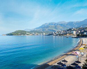 Fototapeta na wymiar Summer coast morning Himare town view with pebbly beach (Albania)