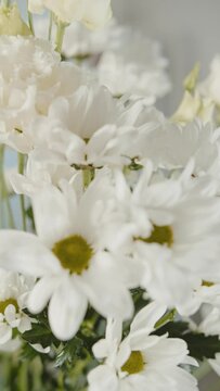 white chrysanthemums and eustoma close up. Vertical video