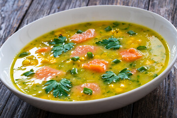 Chowder - american style fish soup on wooden table
