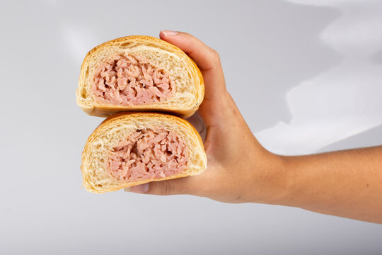 Ham pieces. Sweet bread stuffed with ham. Traditional Venezuelan snack. Bakery food. Breakfast