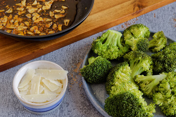 Steamed broccoli with parmigiano reggiano cheese flakes and fried chili garlic sauce.