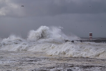 Beacon and pier under heavy storm
