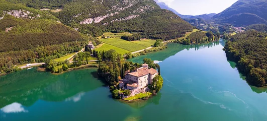 Tafelkleed Beautiful Toblino lake is considered one of the most romantic lakes in the Trentino, Italy. aerial drone panoramic view with medieval castle. Sarca Valley © Freesurf