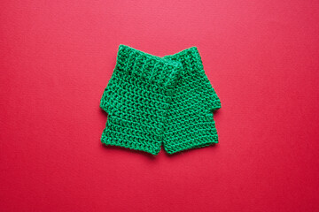 green gloves on red background