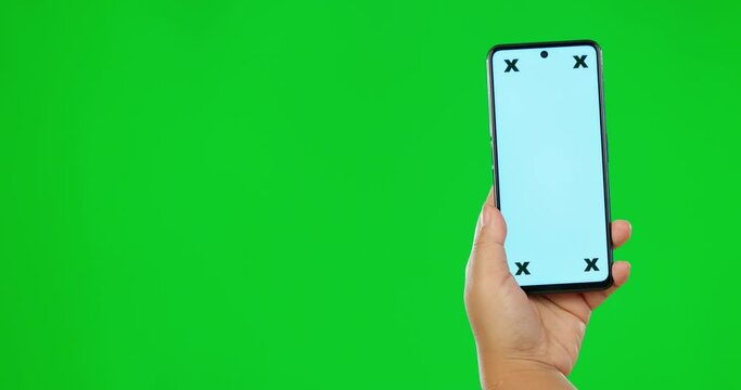 Hand, phone and green screen for marketing, app or advertising an announcement, promotion or logo on studi background. Hands, smartphone and chroma key for information, technology or branding mockup