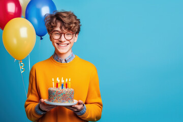 Happy smiling guy teenager holding festive cake with candles. Prepares for party or birthday celebration expresses good emotions. Birthday party for kids. Generative ai.