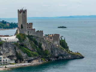 Fototapeta na wymiar Town of Malcesine castle and waterfront view, Veneto region of Italy, Lago di Garda - Castle of Malcesine - Castello Scaligero di Malcesine 