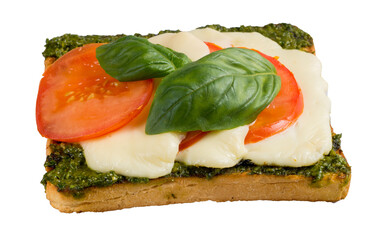 Open sandwich with mozzarella, tomato, pesto and basil on toasted ciabatta, horizontal, closeup
