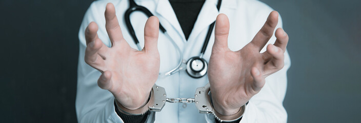 doctor hand handcuffs