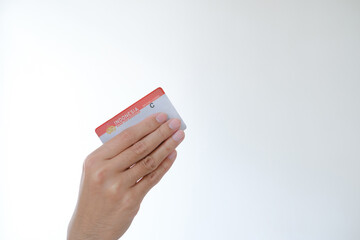 Surat Ijin Mengemudi or SIM C means Indonesian Driving License for a motorcycle held by a hand on...