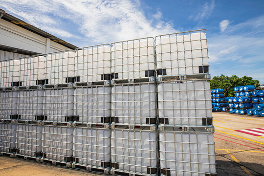 The stock of plastic barrels for the chemical industry. white plastic containers. Chemical industry.