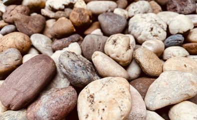 Fototapeta na wymiar pebble, rock, textured, smooth, round, abstract, decoration, gravel, nature, small, outdoor, garden, mineral, material, stone, shape, wallpaper, background, texture, surface, rough, ground, wall, sea,