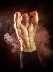 Fototapeta premium Handsome shirtless male bodybuilder in studio shot